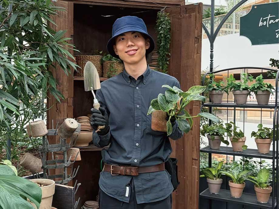 A gardener tending to "Sounds Forest" on the 5th floor of The Hyundai Seoul